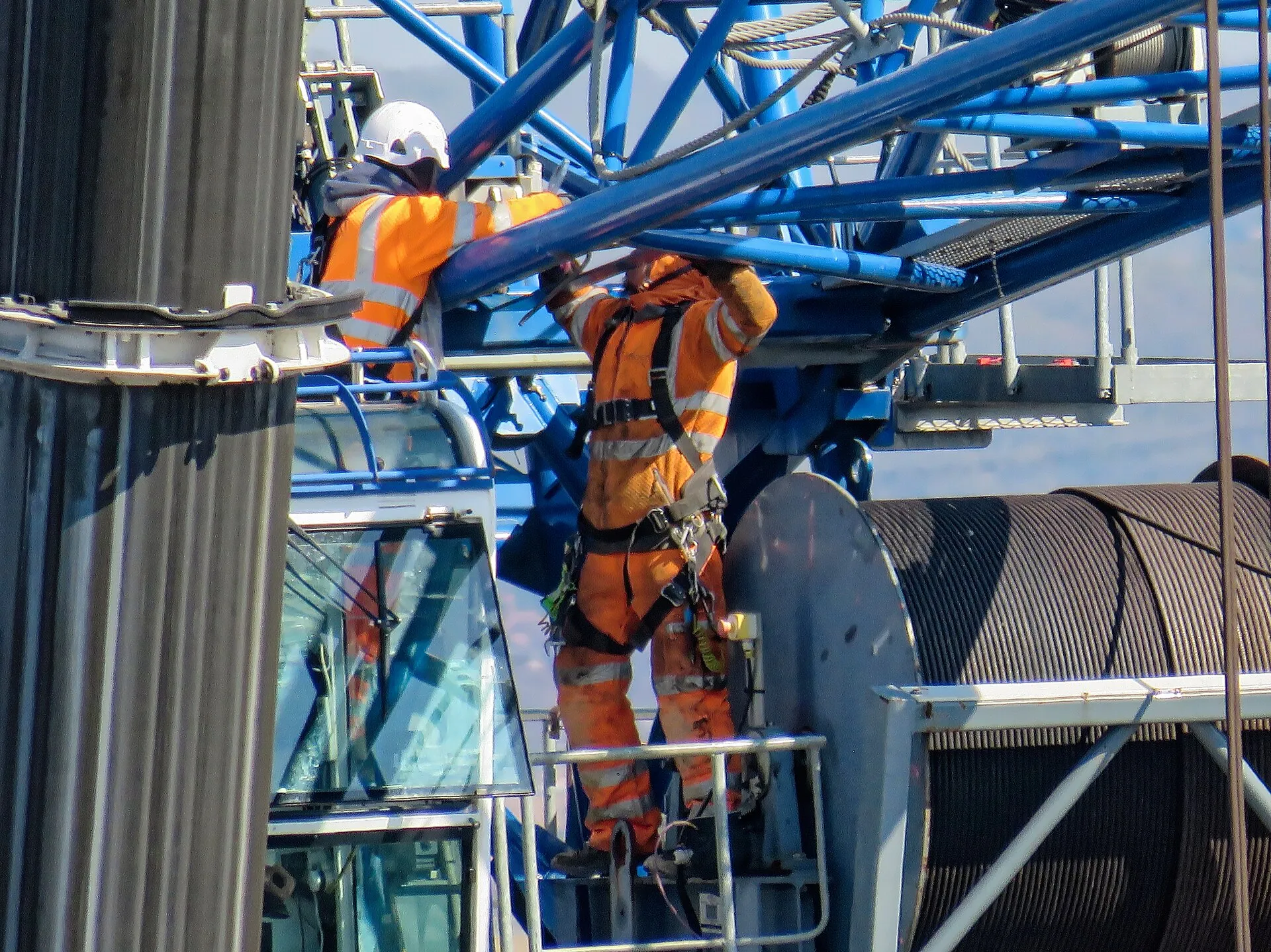 construction workers building crane