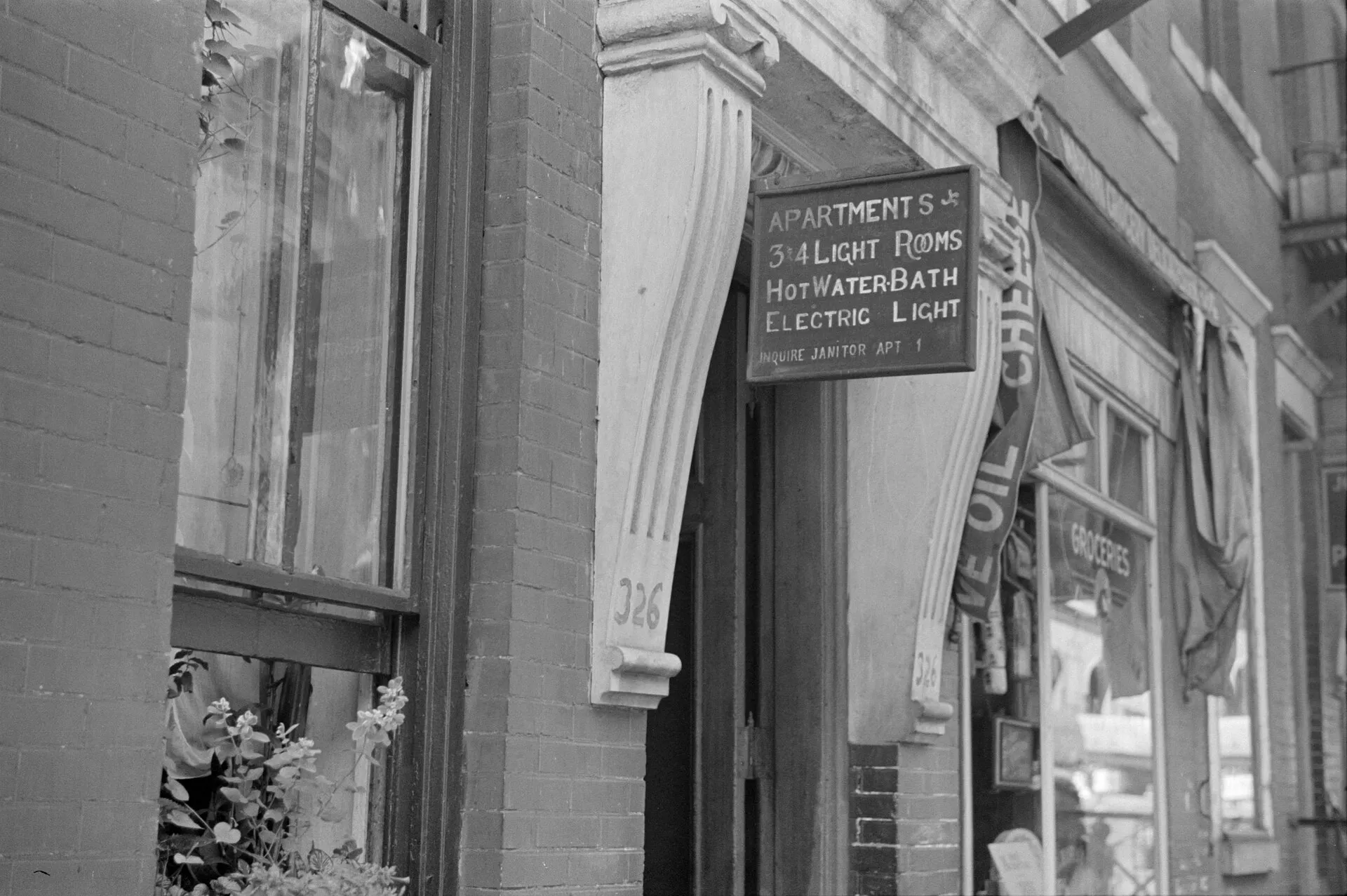 apartment for rent sign in city street
