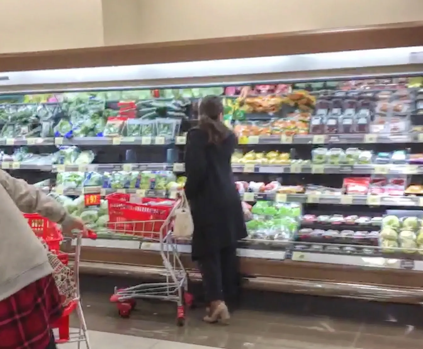 shopping cart in supermarket aisle